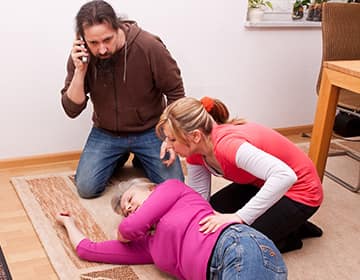 Two people assisting in first aid