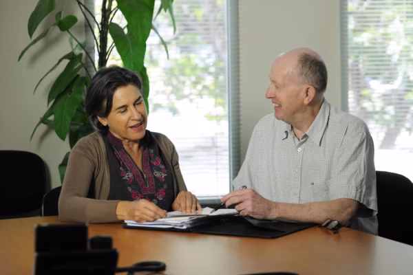 Man and woman sitting at desk