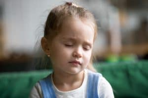 Young girl with eyes closed