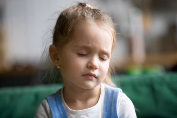 Young girl with eyes closed
