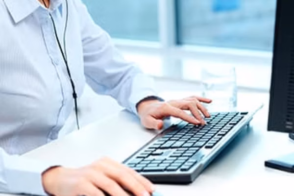 Woman's hands on computer keyboard