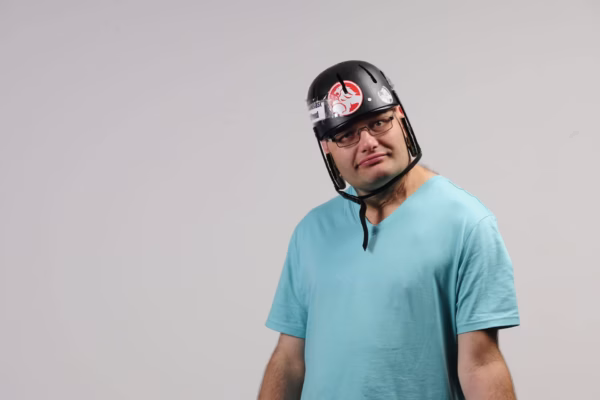 Disabled man wearing helmet
