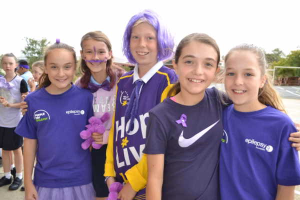 Girls at school purple day event