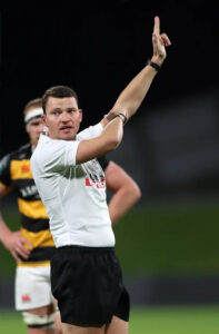 Photo of Angus Mabey refereeing.